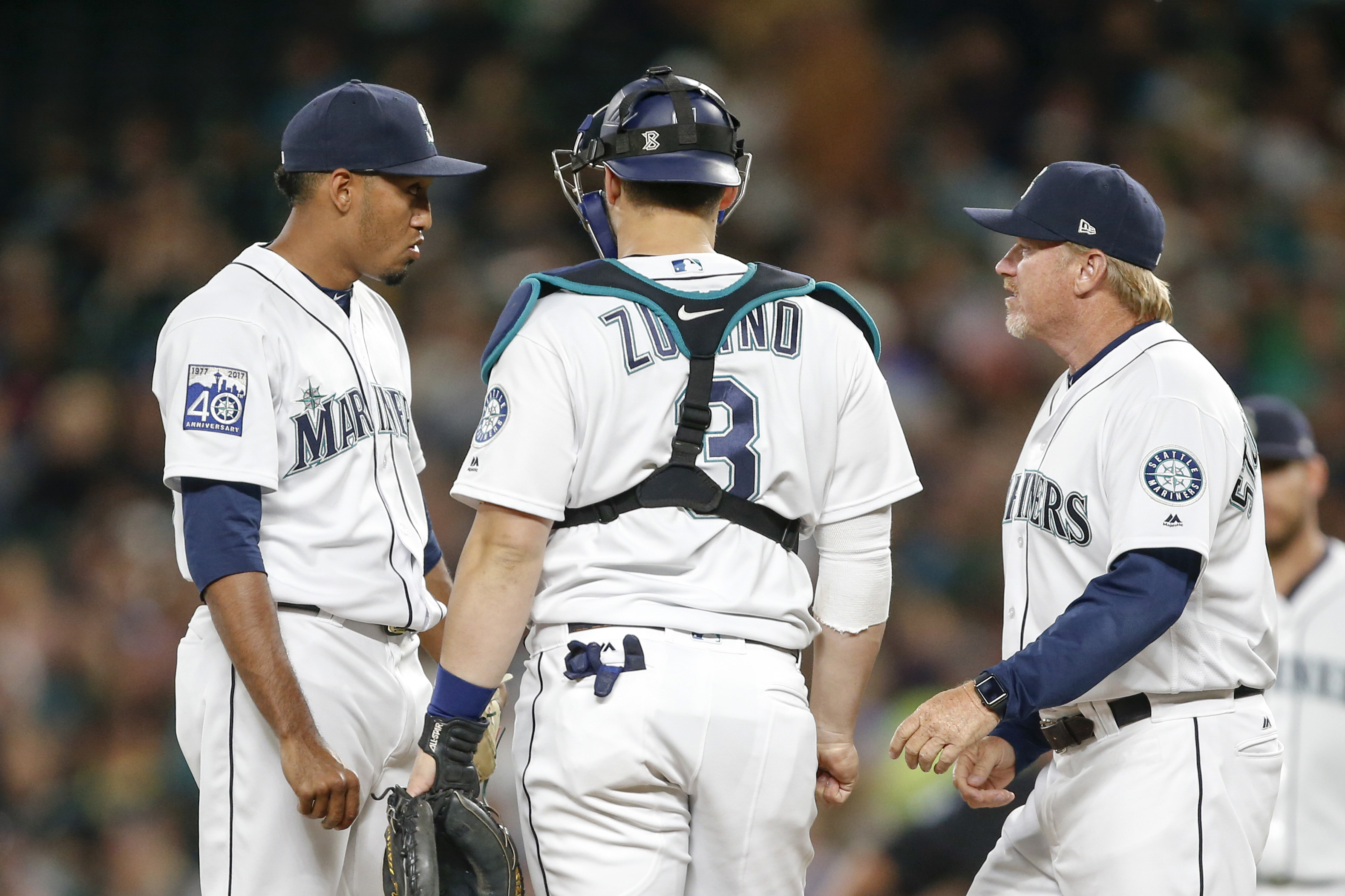 Seattle Mariners closing pitcher Edwin Diaz walks on the field for